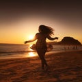 Plump woman dancing on beach Royalty Free Stock Photo