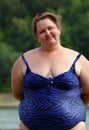 Plump woman standing near river Royalty Free Stock Photo
