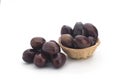 Plums in a basket on a white background Royalty Free Stock Photo