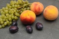 Plums, grapes, peaches. Still life with pears, grapes and plums. Healthy nutrition fruit delicious organic diet