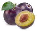 Plums half with leaves isolated