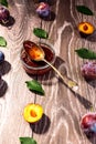 Plums and jam of plum on wood background Royalty Free Stock Photo