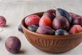 Plums on a light background.