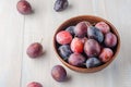 Plums on a light background.