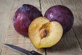 Plums over rustic wooden table Royalty Free Stock Photo