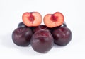 plums on a white background