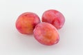 Plums on white background