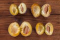 Plums on wood, halfed Royalty Free Stock Photo