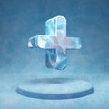 Plus icon. Cracked blue Ice Plus symbol on blue snow podium Royalty Free Stock Photo