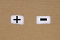 plus and minus signs in the cardboard holes . The concept of doubt and decision-making