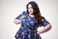 Plus size fashion model in casual clothes, fat woman on beige background, overweight female body Royalty Free Stock Photo