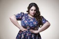 Plus size fashion model in casual clothes, fat woman on beige background, overweight female body Royalty Free Stock Photo