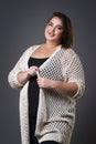 Plus size fashion model in casual clothes, fat woman on gray background, overweight female body Royalty Free Stock Photo