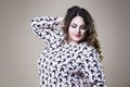 Plus size fashion model in casual clothes, fat woman on studio background, overweight female body Royalty Free Stock Photo