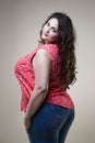 Plus size fashion model in casual clothes, fat woman on studio background, overweight female body Royalty Free Stock Photo