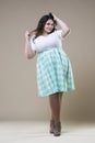 Plus size fashion model in casual clothes, fat woman on studio background, overweight female body Royalty Free Stock Photo