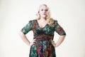 Plus size fashion model, fat woman on beige background, overweight female body Royalty Free Stock Photo