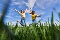 Plus size girls jumping for joy in a wheat field Royalty Free Stock Photo