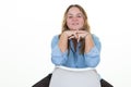 Plus Size Model blonde young woman with long hair blonde sitting back chair hands on chin posing in studio white background Royalty Free Stock Photo