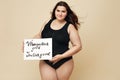 Plus Size Model. Full-figured Woman Portrait. Female Holding Motivational Poster With Inspiration Quote Written On Paper.