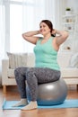 Plus size woman exercising with fitness ball Royalty Free Stock Photo