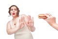 Plus size woman refusing junk food Royalty Free Stock Photo