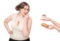 Plus size woman seduced with hamburger and pastry Royalty Free Stock Photo