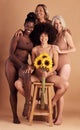 Plus size women, lingerie and group portrait with sunflower for beauty, wellness and solidarity in studio. Model team Royalty Free Stock Photo