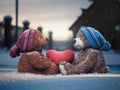 Plush bears with a heart in paws