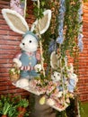Plush bunnies that symbolize Easter surrounded by ornaments and flowers decorating a beautiful reception Royalty Free Stock Photo