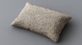 A plush cushion with a rectangular block shape features a soft foam core in a macro product image set against a neutral Royalty Free Stock Photo