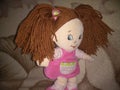 Plush doll in a pink dress