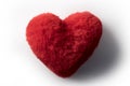 Plush heart shape furry red pillow or cushion Royalty Free Stock Photo