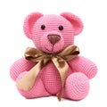Plush pink bear with a brown ribbon around its neck