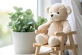 plush teddy bear on a small wooden rocking chair Royalty Free Stock Photo