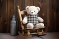 plush teddy bear on a small wooden rocking chair Royalty Free Stock Photo