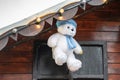 Plush toy bear hang above the roof Royalty Free Stock Photo