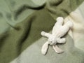 Plush toy bunny on green woollen blanket Royalty Free Stock Photo