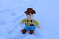 Plush toy for children on white snow