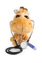 Plush toy giraffe with stethoscope and thermometer