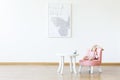 Plush toy on pink chair at table in white girl`s room interior w Royalty Free Stock Photo