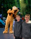 Disney Character Parade Pluto with children smiling