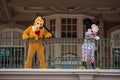 Pluto and Mickey Mouse waving from the balcony at Walt Disney World Railroad at Magic Kingdom 344 Royalty Free Stock Photo