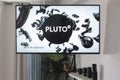 Pluto TV internet cable provider logo on a living room flatscreen television