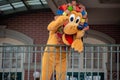 Pluto waving from the balcony at Walt Disney World Railroad in Halloween season at Magic Kingdom 5 Royalty Free Stock Photo