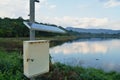 Pluviometer or rain gauge in mountain background with rain cloud on sky Royalty Free Stock Photo