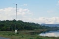 Pluviometer or rain gauge in mountain background with rain cloud on sky Royalty Free Stock Photo