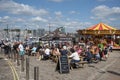 People on the waterfront enjoy a drink. Barbican, Plymouth, UK Royalty Free Stock Photo