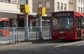 Red bus approaching a speed camera in the city centre, Plymouth, UK