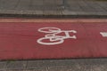 Cycleway painted deep. red colour. Royalty Free Stock Photo